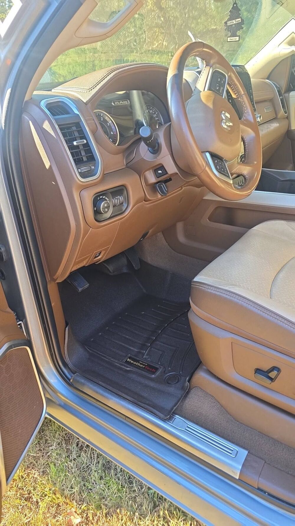 Ram 3500 driver seat, dash and floor mat after an interior detail